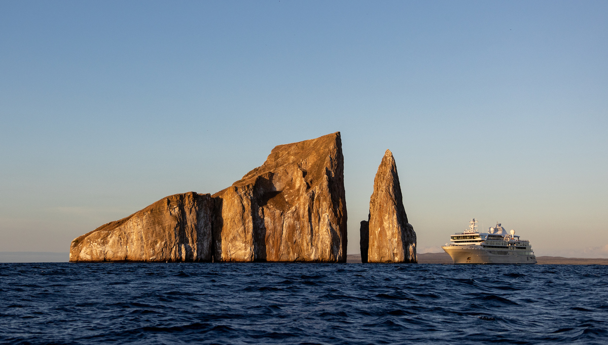 Silver Origin cruising past Kicker Rock in the Galapagos