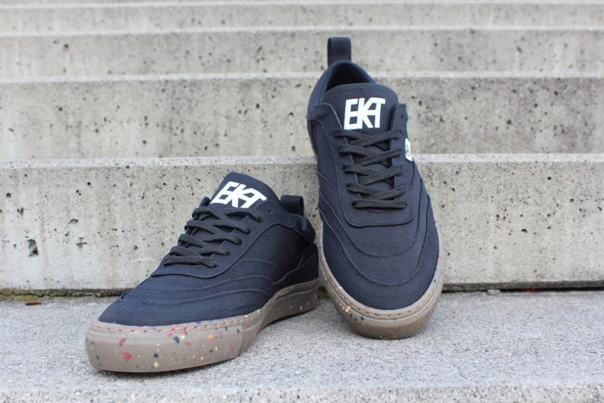 A pair of black Alchemy-X trainers